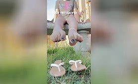 Exotic Goddess Em Onlyfans flip flops dangling in the nature