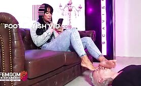 Lady Nisha ignoring her footstool while playing around on her phone